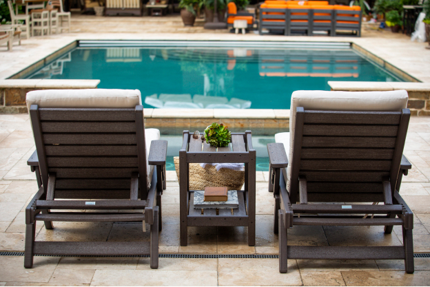 Two Breezesta chaise lounges by a pool